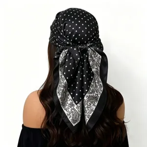 Detailed view of 88cm black satin square scarf featuring white polka dots and paisley border.