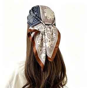 Detailed view of retro paisley silk square scarf worn as a stylish hair bandana, 70cm size.