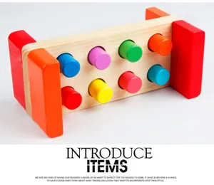 Wooden pounding bench detail showing colorful pegs and natural wood grain frame structure.