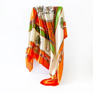 Detailed view of the 90cm silk scarf with classic baroque chain and strap print design.
