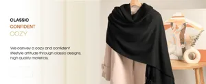 Detailed view of the soft black cashmere feel winter scarf draped in a cozy home setting.