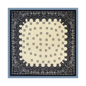 Detailed view of the classic black and white paisley pattern square scarf fabric texture.