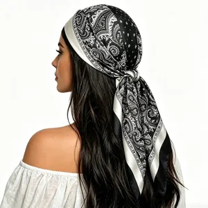 Detail view of black and white paisley silk headscarf, elegant square hair wrap scarf.