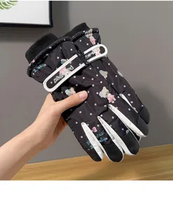 Detailed view of women's winter ski gloves with cute bear pattern, fleece lined and warm.