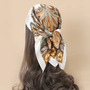 Detailed view of elegant paisley print square hair scarf, silky satin head wrap for women styling.
