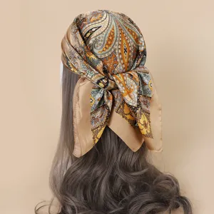 Detailed view of the 70cm paisley print imitation silk square scarf, perfect as a chic head or neck wrap.