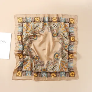 Close-up detail of the vintage paisley print square silk scarf with elegant floral border design.
