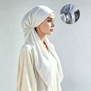 Detail view of solid satin hijab showing smooth fabric texture and back pleat design.