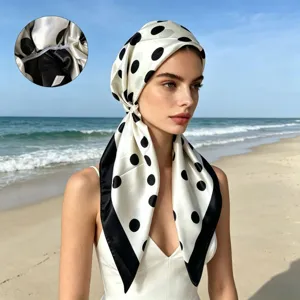 Detail view of satin polka dot headscarf cap, showing interior stitching and smooth fabric texture.