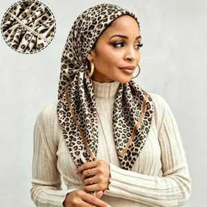 Close-up detail of the leopard print satin headscarf showing smooth fabric and neat stitching.