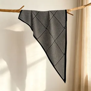 Elegant black and white geometric printed silk scarf detail, large triangle shawl and sun protection.