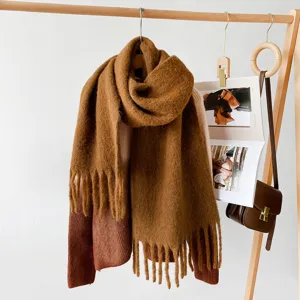 Thick warm winter mohair knitted scarf with fringe detail, cozy apparel accessory for cold weather.