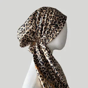 Detailed view of satin leopard print head scarf, soft silk bonnet wrap for women fashion.