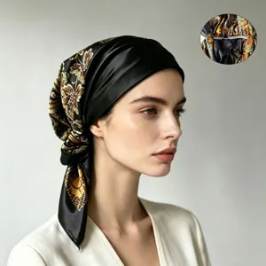 Detailed close-up showing the soft inner lining and premium stitching of the elegant satin paisley headscarf.