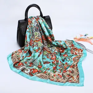Detailed view of women's 88cm satin silk square scarf featuring vibrant paisley floral print.