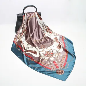 Detailed view of 90cm square silk scarf with luxury chain print, elegant fashion accessory for women.
