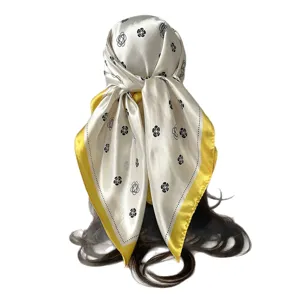 Elegant 90cm satin silk square scarf with chic floral print and yellow border for women.