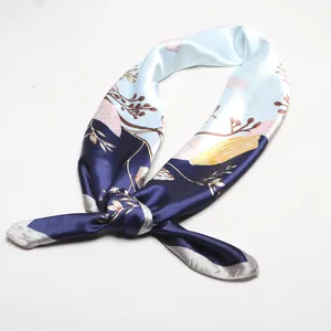 Elegant blue satin square scarf with delicate botanical and shell print, perfect chic accessory.