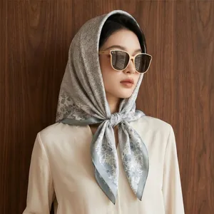 Women's 90cm square silk scarf featuring an elegant grey floral print for spring and summer.