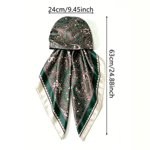 Detail view of satin paisley print silk scarf cap, stylish green headwrap for summer sun protection.