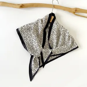 Classic black and white paisley silk scarf, elegant triangular design for women's summer wear.