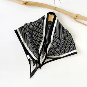 Detailed view of women fashion black and white striped silk scarf for summer daily wear.