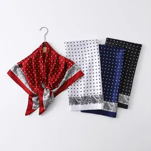 Close-up of 88cm satin square scarf with chic polka dot and classic paisley print design.