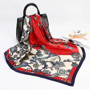 Detailed view of luxury paisley print 88cm satin silk square scarf for women, elegant drape.