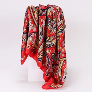 Red paisley print satin square scarf for women, elegant silk-feel neckerchief detail.
