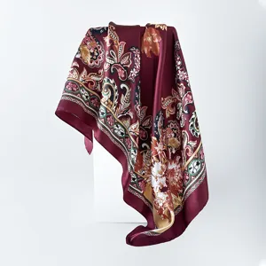 Detail view of the burgundy satin silk square scarf featuring elegant floral and paisley print.