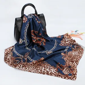 Detailed view of a dark blue leopard print baroque chain silk scarf, 90cm square scarf.