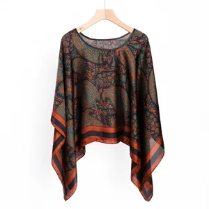 Detailed view of the retro paisley printed women pullover shawl, elegant teal and orange floral pattern.