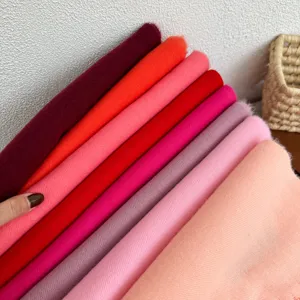 Close-up detail view of multi-color imitation cashmere scarves showing soft texture and rich hues.