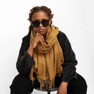 Solid color imitation cashmere scarf with long tassels, warm and stylish winter accessory.