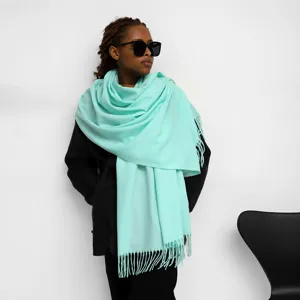 Mint green cashmere-feel winter scarf detail, soft knitted fabric with stylish fringe hem.