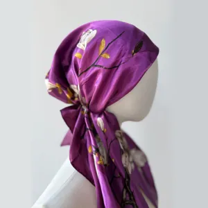 Detailed view of women's purple satin floral print headscarf cap, elegant summer sun protection.