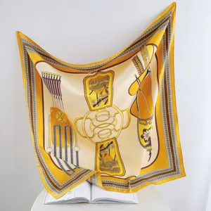 Detail view of a luxury yellow silk twill square scarf with vintage equestrian arrow print.
