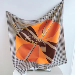 Luxury 90cm silk scarf with classic orange bag strap print, elegant women accessory detail.