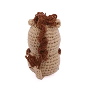 Detailed view of handmade crochet knitted wool pony doll back and mane texture features.