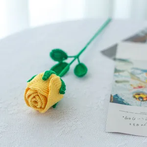 Handmade crochet yellow rose detail, exquisite wool knit flower close-up, soft texture decor.