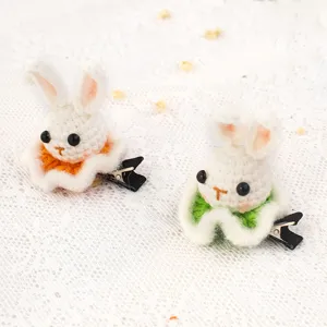 Handmade crochet hair clip featuring cute bunny design with colorful ruffle base and metal clip.