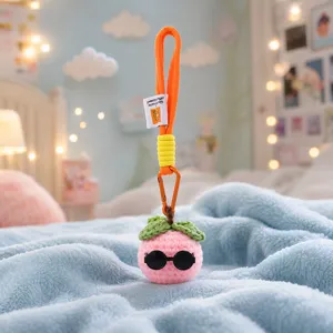 Porte-clés pêche au crochet fait main charmant sac rose fruit avec des lunettes cool