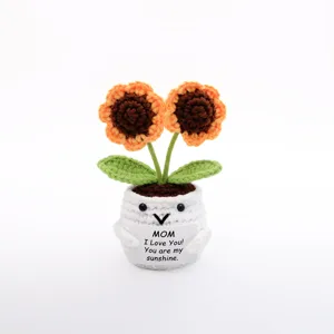 Handmade crochet sunflower potted plant detail view, cute woolen flower ornament for home decor.