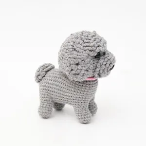 Handmade cute crochet gray poodle dog toy, fluffy yarn puppy keychain pendant detail.