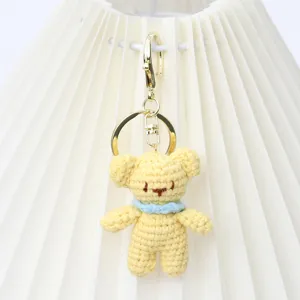 Handmade crochet yellow bear keychain, cute yarn plush bag charm and metal keyring accessory.