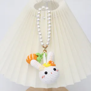 Handmade crochet rabbit plush pendant with pearl strap key chain detail view showcase.