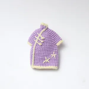 Handmade crochet miniature purple qipao dress detail, retro Chinese style doll accessory craft.