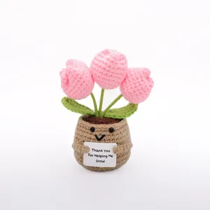 Handmade crochet pink tulip potted plant detail view, cute mini crochet flower decor.