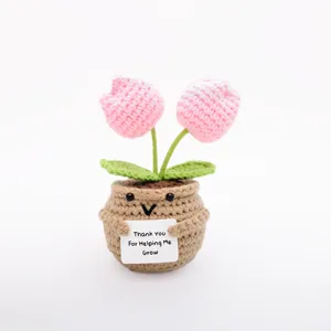Handmade crochet pink tulip potted plant detail view, cute flower decor for home room.