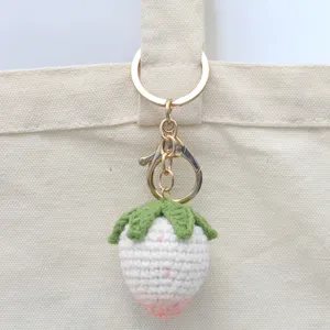 Handcrafted crochet strawberry keychain and cute bag charm accessory for daily use.